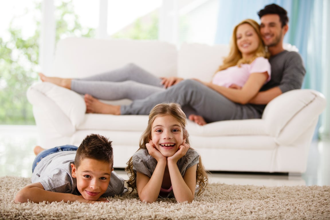 Cheerful family relaxing at home